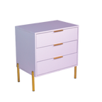A white melamine pedestal with gold legs and gold handles, consisting of three drawers.