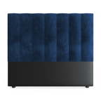 A royal blue double headboard upholstered in velvet, with a plain black base.