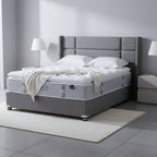 Mattress on a gray platform with a neutral background