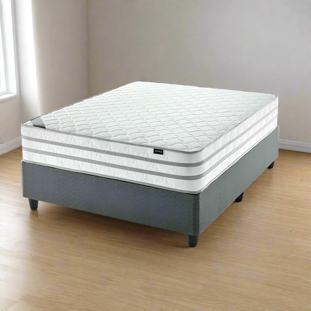 Mattress with gray frame on a white background