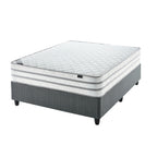 A firm white mattress on a single extra length bed with a grey bed frame.