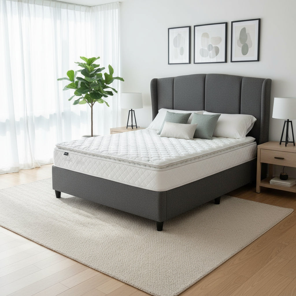 Mattress on a wooden floor with a neutral background