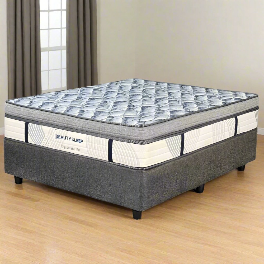 Gray and white mattress with 'Beauty Sleep' branding on a white background