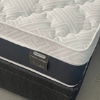 Nusleep mattress with a visible brand label on a plain background