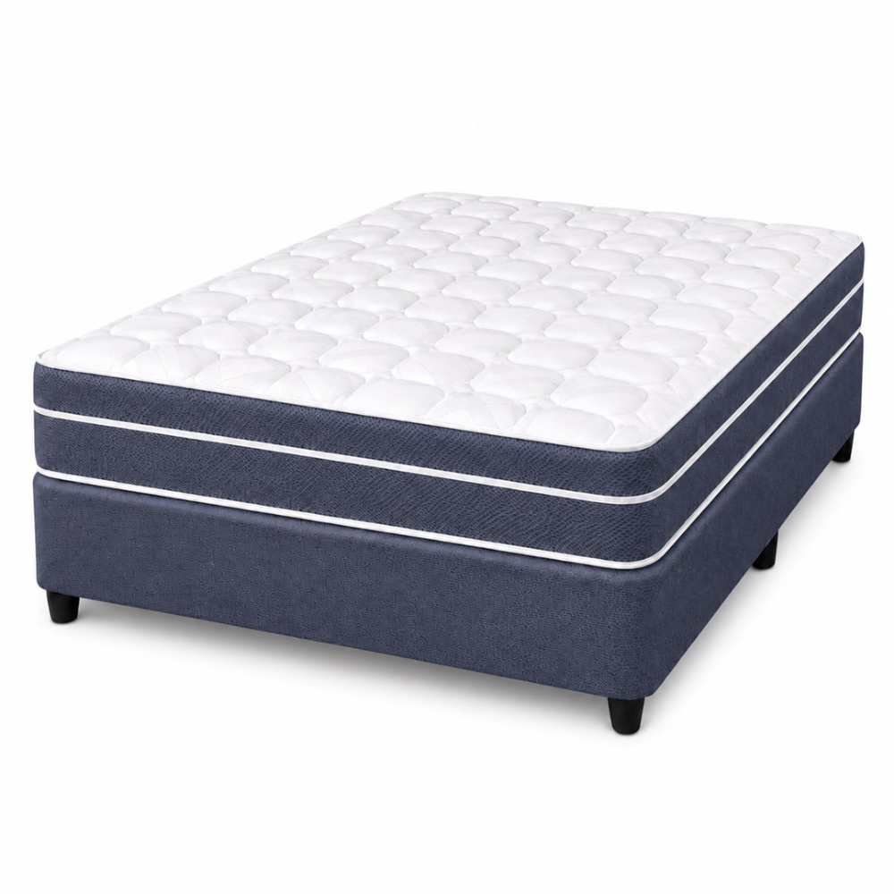 A mattress on a box spring with a white quilted top and navy blue sides, shown on a plain white background.