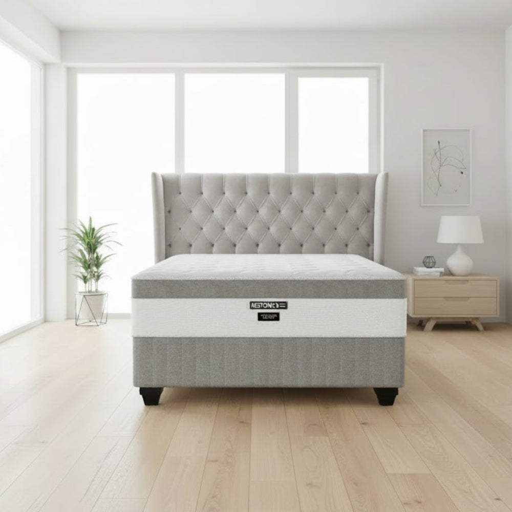 Gray mattress with a white band and Restonic logo on a white background