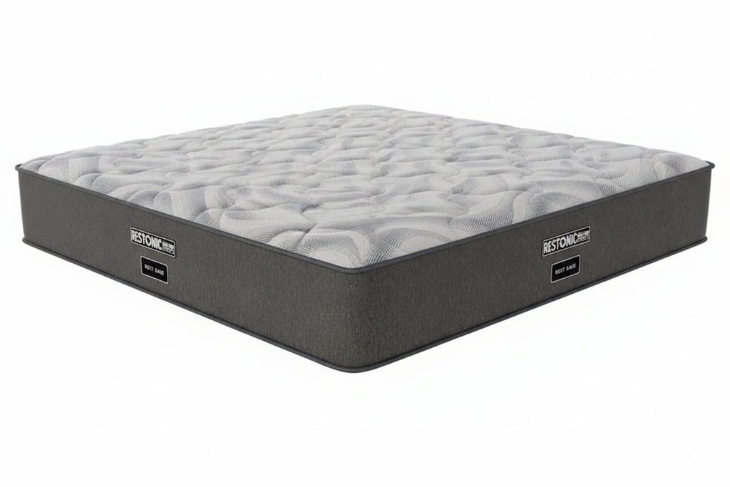 Gray mattress with 'Restonic' branding on a white background