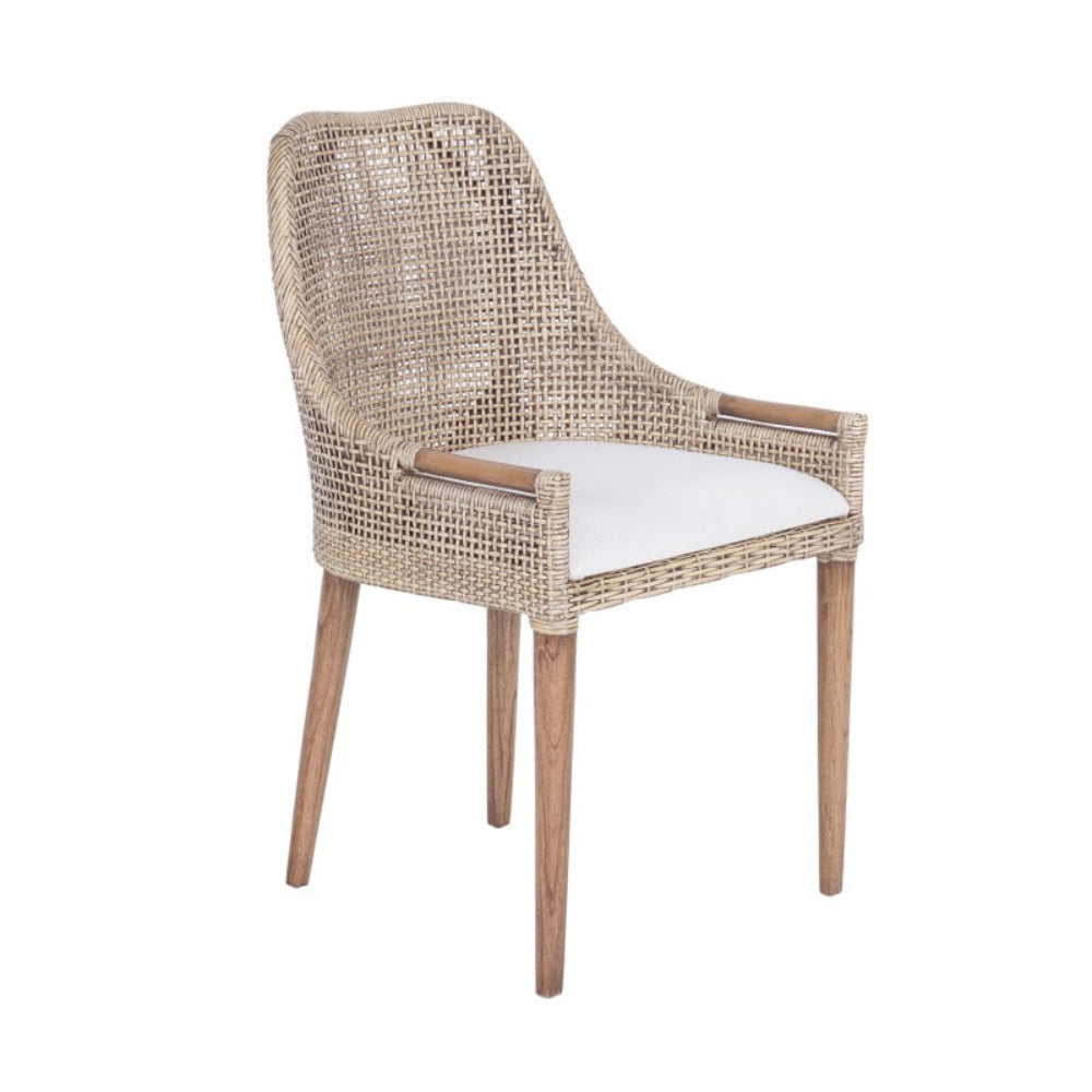 Wicker chair with a white cushion on a white background