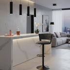 Gray bar stool with quilted backrest on a white background