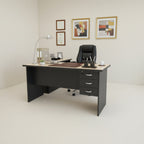 Black office desk with a light wood top on a white background