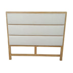 White upholstered headboard with wooden frame on a white background
