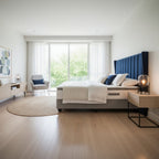Modern bedroom with a bed, side tables, and a chair.