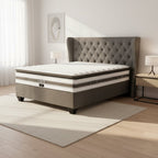 Gray and white mattress with 'Restonic' branding on a white background