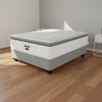 Gray mattress with a visible brand logo on a white background