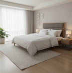 Modern bedroom with a bed, nightstands, and decor elements.