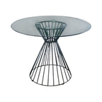 Round glass table with black wire base on a white background
