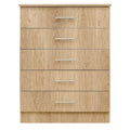 Wooden dresser with five drawers on a white background